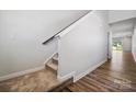 Bright entryway boasting carpeted stairs and railing alongside elegant hardwood floors at 310 Bezelle Ave, York, SC 29745