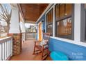 Charming front porch showcasing a rocking chair and a view of the neighborhood at 331 Solomon St, Charlotte, NC 28216