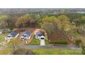 New construction home with black roof, bright yellow door, and green lawn at 412 W Westview St, Gastonia, NC 28052