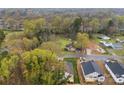 New construction home surrounded by trees at 412 W Westview St, Gastonia, NC 28052