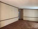 Spacious living room featuring a large window and neutral walls at 459 Towell St, Mooresville, NC 28115