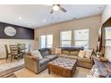 Open-concept living room with large sectional couch, dining area, and plenty of natural light at 502 Tayberry Ln, Fort Mill, SC 29715