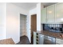Walk-in pantry features built-in shelving and a view into the kitchen at 505 E 6Th St # 1006, Charlotte, NC 28202