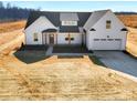 New construction home featuring farmhouse design with prominent gables and an attached garage at 520 Shoal Rd, Lincolnton, NC 28092