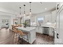 Bright kitchen showcases an island, stainless steel appliances, and open layout flowing into the dining area at 5541 Galloway Dr # 83, Stanfield, NC 28163