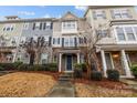 Inviting townhome exterior showcases mixed siding, stone details, and a tidy front yard at 824 Imperial Ct, Charlotte, NC 28273