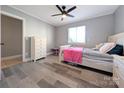 Cozy bedroom with a ceiling fan, wood-look flooring, and lots of natural light at 1056 Latham Ct # B104, Rock Hill, SC 29732