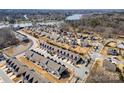Scenic aerial view of a townhome community near a lake, featuring well-maintained properties and natural surroundings at 107 Dellbrook St # B, Mooresville, NC 28117