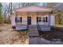 Inviting single-story home featuring a cozy front porch and classic architectural details at 1229 Jenkins St, Rock Hill, SC 29732