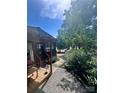 Exterior showcases covered porch, small storage shed, and view of waterway at 152 Muskhogean Way, Mount Gilead, NC 27306