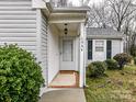 Inviting front entryway with a covered porch and a charming welcome mat at 1544 Hunt Club Ct, Rock Hill, SC 29732