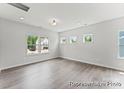 Living room featuring lots of natural light, with hardwood floors, and neutral wall paint at 156 Tangle River Dr # 35, Statesville, NC 28677
