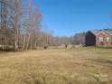 Large backyard with trees on the side property line at 1638 Bess Town Rd, Bessemer City, NC 28016