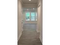 Hallway featuring attractive wood-look floors and neutral paint at 2036 Skyhawk Dr, York, SC 29745