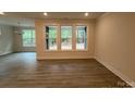 Bright living space with large windows and wood-look floors at 2036 Skyhawk Dr, York, SC 29745