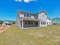 Expansive backyard featuring a covered patio and ample green space at 2211 Camber Dr # Cwo0103, Gastonia, NC 28054