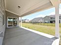 Covered patio with views of a fenced yard and neighboring homes at 2211 Camber Dr # Cwo0103, Gastonia, NC 28054