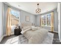 Serene bedroom with soft lighting, neutral tones, large windows, and plush rug at 3288 Sherman Dr, Lancaster, SC 29720