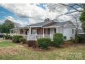 Charming single-story home with brick and vinyl siding and landscaped yard at 816 S Point Rd, Belmont, NC 28012