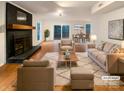 Bright living room with hardwood floors, a fireplace, and an open layout perfect for entertaining at 9105 Capsdale Ct, Huntersville, NC 28078