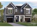 Charming two-story townhome with a modern gray and white exterior and well-manicured front lawn at 2526 Elkwood Cir, Charlotte, NC 28205