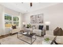 Bright living room featuring a neutral color scheme, modern furniture, and large windows for natural light at 8465 Old Plank Rd, Charlotte, NC 28216