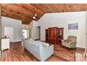 Bright living room with vaulted ceiling, hardwood floors, and stylish decor at 10213 Conistan Pl, Cornelius, NC 28031