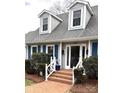 Charming home featuring dormer windows, brick walkway and blue shutters, offering classic curb appeal at 1207 Chadbourne Ave, Concord, NC 28027