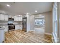 Contemporary kitchen with stainless appliances and adjacent room at 2625 20Th Ne St, Hickory, NC 28601