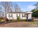 Traditional single-story house with dark shutters and lush bushes adding to the curb appeal at 426 Holland Memorial Church Rd, Bessemer City, NC 28016