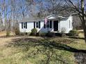 Charming single-story home featuring a well-manicured front yard and classic curb appeal at 426 Holland Memorial Church Rd, Bessemer City, NC 28016