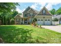 Attractive two-story home with lush green lawn, stone accents, and a well-manicured front yard at 8143 Summit Ridge Dr # 41, Catawba, NC 28609