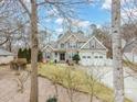 Charming two-story home featuring a stone and siding exterior, manicured lawn, and a three-car garage at 8143 Summit Ridge Dr # 41, Catawba, NC 28609