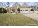 Charming two-story home with a manicured lawn, three-car garage and a beautiful blend of siding and stone at 8143 Summit Ridge Dr # 41, Catawba, NC 28609