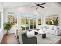 Cozy sun room with vaulted ceiling, lots of natural light, ceiling fan and backyard views at 10101 Bayart Way, Huntersville, NC 28078