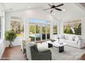 Cozy sun room with vaulted ceiling, lots of natural light, ceiling fan and backyard views at 10101 Bayart Way, Huntersville, NC 28078