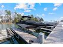 Covered boat on lift offers water access and lakeside living with great recreational opportunities at 111 Kent Ct, Mooresville, NC 28117