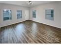 Spacious living room with hardwood floors and plenty of natural light at 120 Cadbury Ln, Fort Mill, SC 29715