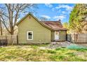 View of the home's exterior with a fenced backyard, and a grassy area, perfect for outdoor activities at 1759 Smith Ave, Gastonia, NC 28052