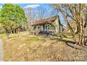 Quaint home with a welcoming front porch, surrounded by mature trees and a spacious yard at 1759 Smith Ave, Gastonia, NC 28052