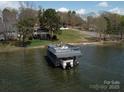 This waterfront home features a private boat dock with an upper deck for lake views at 254 N Shoreline N Dr # 38, New London, NC 28127