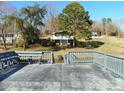 Expansive dock with seating area offering stunning views of the lake and surrounding landscape at 254 N Shoreline N Dr # 38, New London, NC 28127