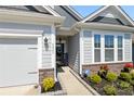 Inviting front entrance featuring well-maintained landscaping, a welcoming front door, and a clean walkway at 4023 Gozzi Dr, Iron Station, NC 28080