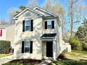 Charming two-story home with black shutters and a well-manicured lawn at 7702 Brisbane Ct, Charlotte, NC 28215