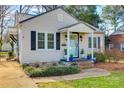A charming home featuring light siding and an inviting front entrance, perfect for new homeowners at 930 Beverly Dr, Rock Hill, SC 29730