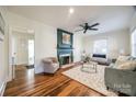 Inviting living room with a decorative fireplace, hardwood floors, and a cozy seating arrangement at 930 Beverly Dr, Rock Hill, SC 29730