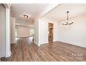 Spacious living room with wood floors, recessed lighting, and an open floor plan leading to the kitchen at 0 6Th Nw St, Hickory, NC 28601