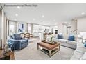 Open-concept living area with stylish furnishings and an abundance of natural light from large windows at 1809 Ab Moore Jr Dr # 3238, Indian Trail, NC 28079