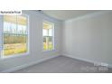 Bright bedroom with two large windows and neutral carpet; plenty of natural light at 2016 Skyhawk Dr, Lake Wylie, SC 29745