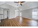 Bright bedroom with a ceiling fan and large window at 2500 Cranbrook Ln # 5, Charlotte, NC 28207